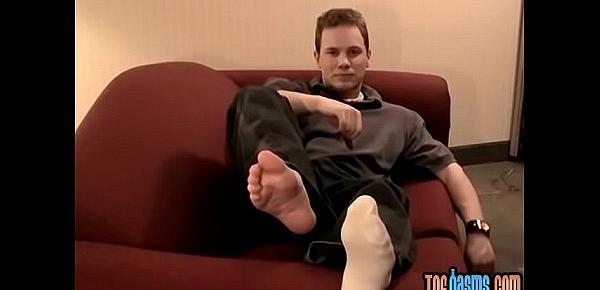  Young and handsome Tommy solo masturbates while showing his feet